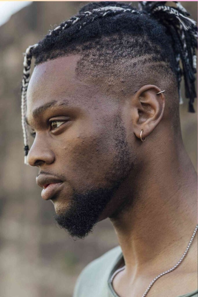 Box Braids with Middle Part in a Man Bun